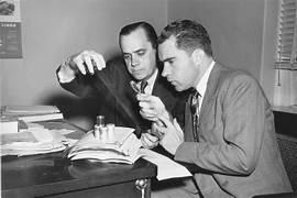 A person looking at something on a desk

AI-generated content may be incorrect.