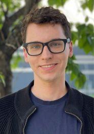 A person wearing glasses and a black jacket

AI-generated content may be incorrect.