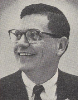 A person wearing glasses and a suit

AI-generated content may be incorrect.