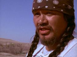 A person with braids and a bandana

AI-generated content may be incorrect.