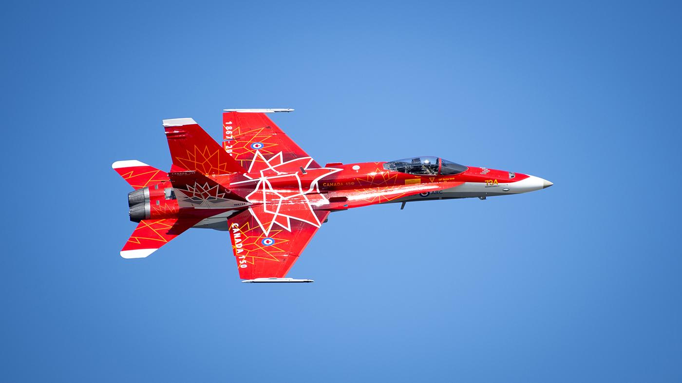 A red and white jet in the sky

AI-generated content may be incorrect.