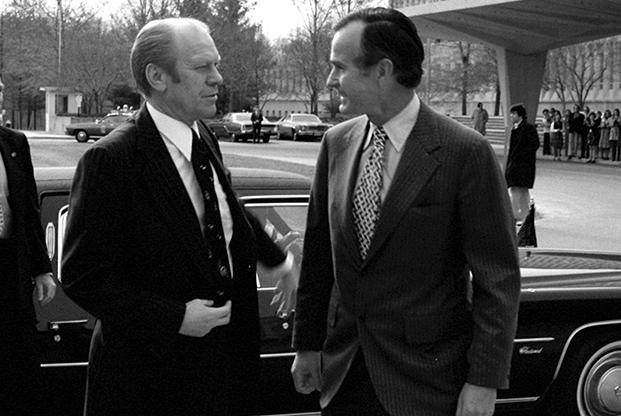 A couple of men in suits talking
AI-generated content may be incorrect.