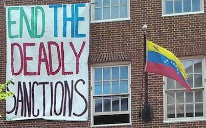 A flag and a banner on a building

AI-generated content may be incorrect.