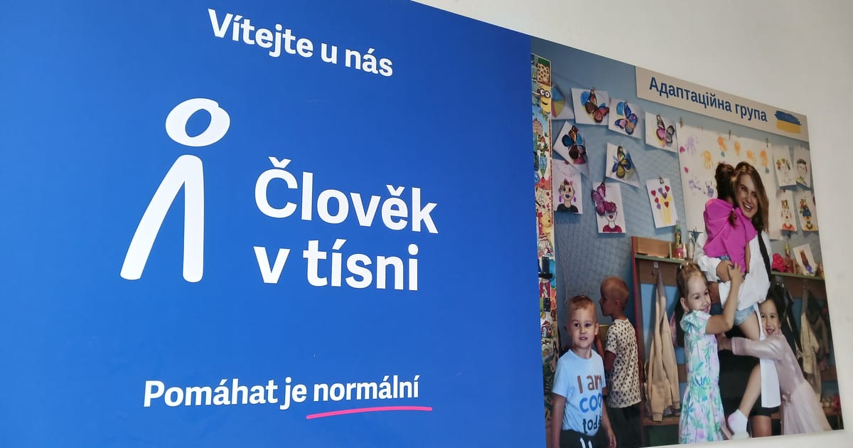 A group of children standing in front of a blue sign

AI-generated content may be incorrect.