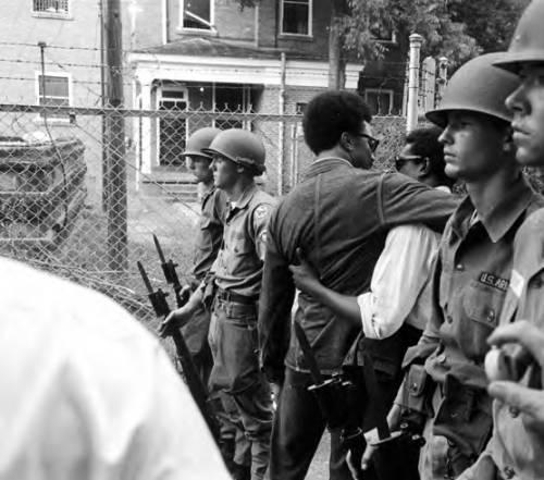 A group of men in military uniforms

AI-generated content may be incorrect.