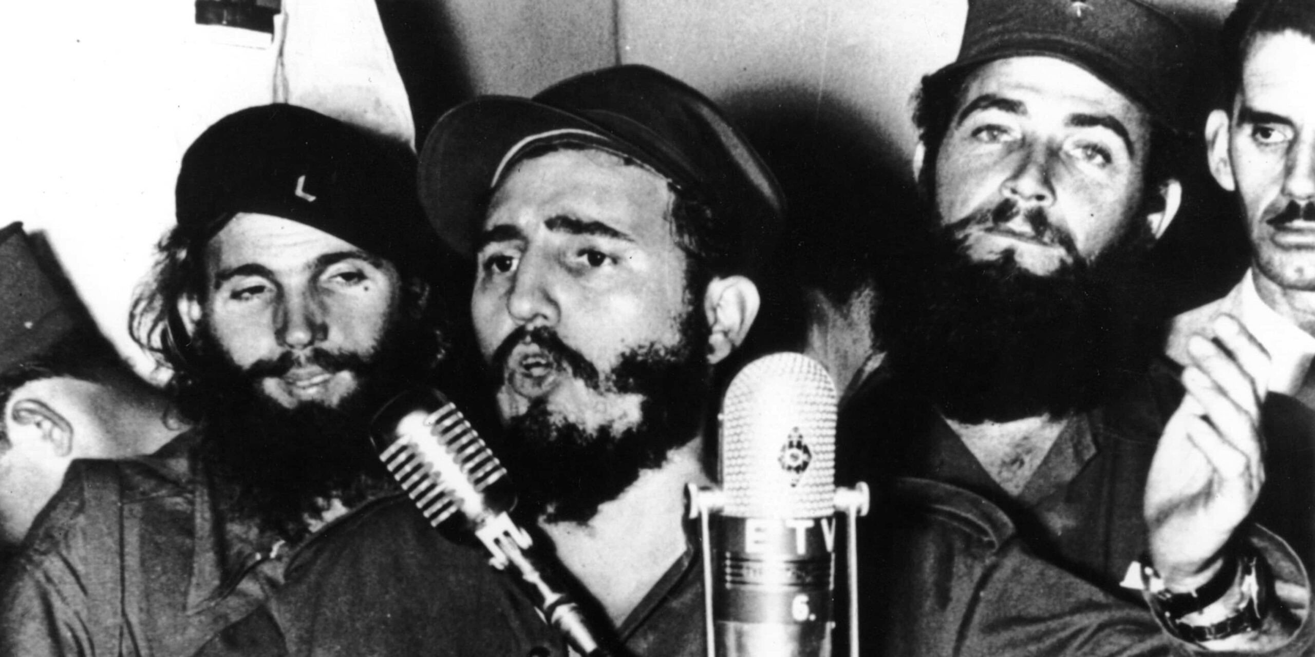 A group of men singing into a microphone

AI-generated content may be incorrect.