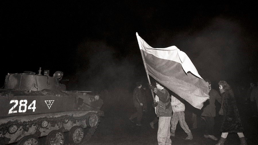 A group of people holding a flag
AI-generated content may be incorrect.