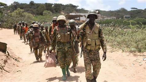 A group of soldiers walking on a dirt road AI-generated content may be incorrect.