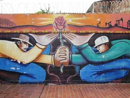 A mural of men holding a flower

AI-generated content may be incorrect.