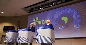 A person and person standing at podiums

AI-generated content may be incorrect.