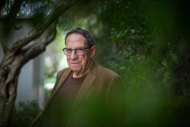 A person in a brown jacket

AI-generated content may be incorrect.