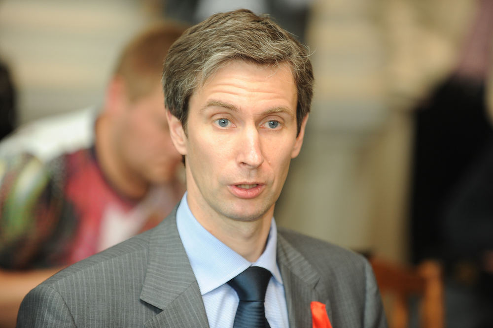 A person in a suit and tie
AI-generated content may be incorrect.