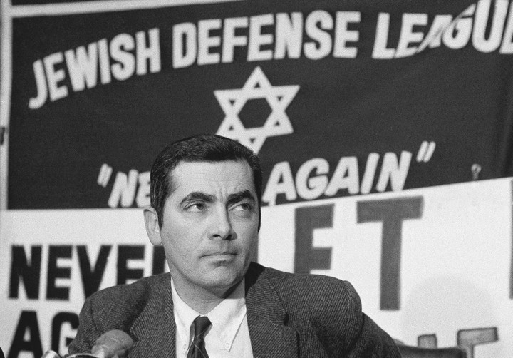 A person in a suit and tie AI-generated content may be incorrect.