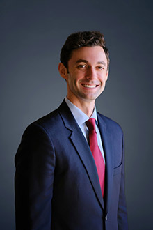 A person in a suit and tie

AI-generated content may be incorrect.