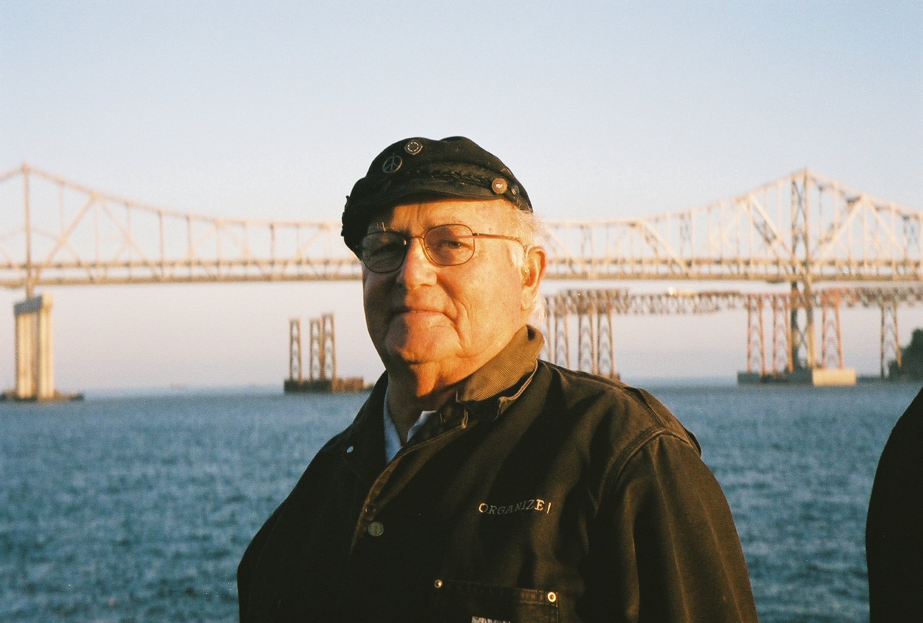 A person standing in front of a bridge

AI-generated content may be incorrect.