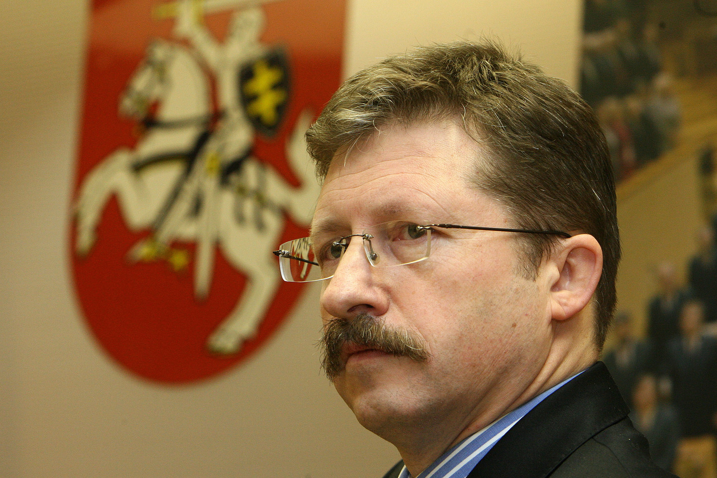 A person with a mustache and glasses
AI-generated content may be incorrect.