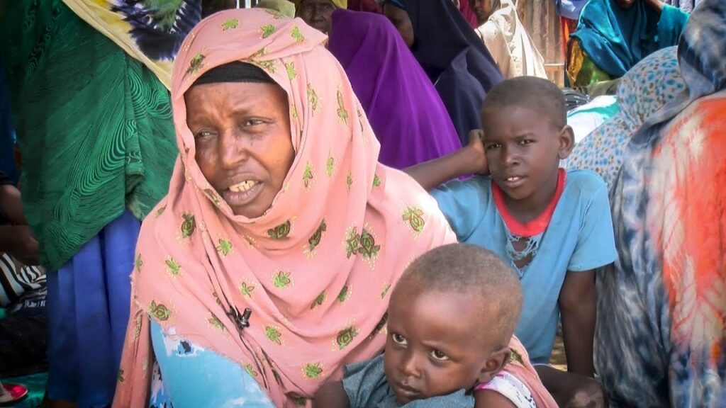 A person with a scarf around her head and a child AI-generated content may be incorrect.