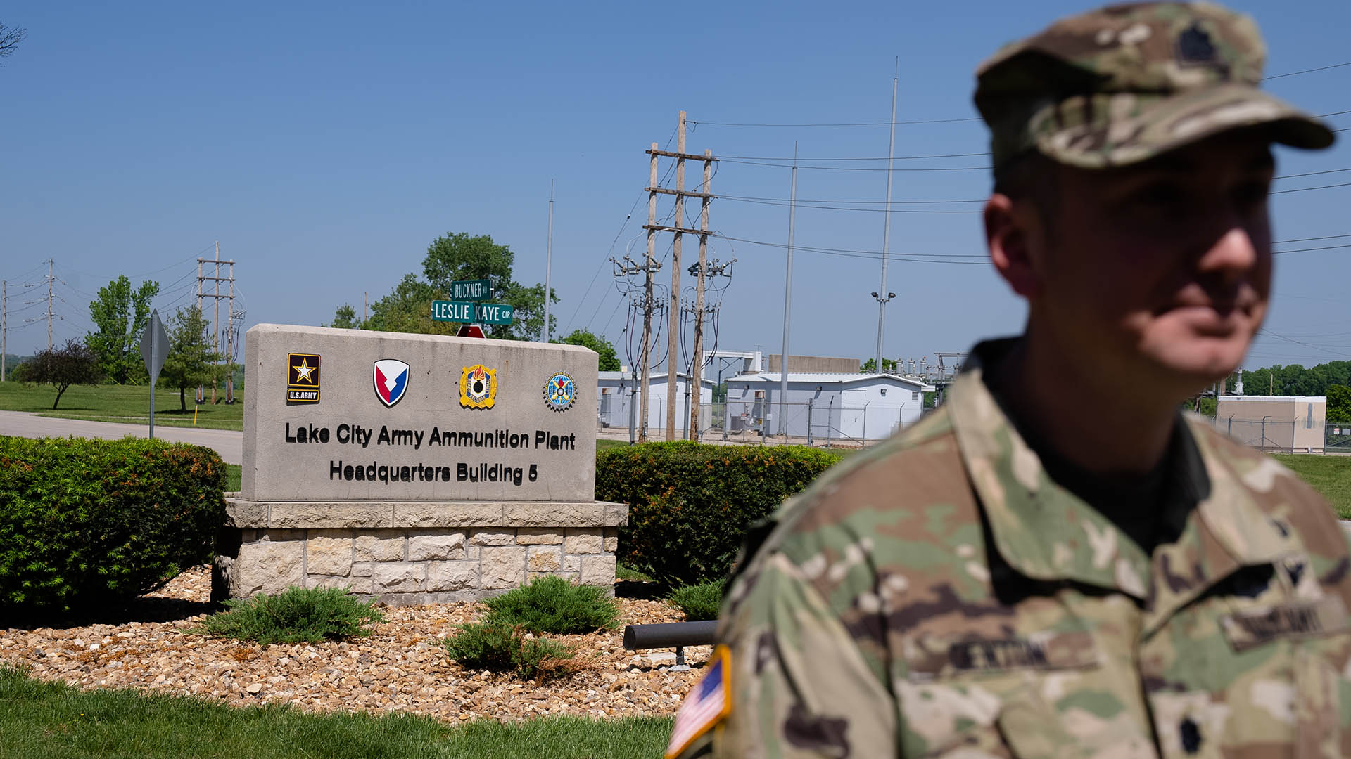 A soldier standing in front of a sign

AI-generated content may be incorrect.