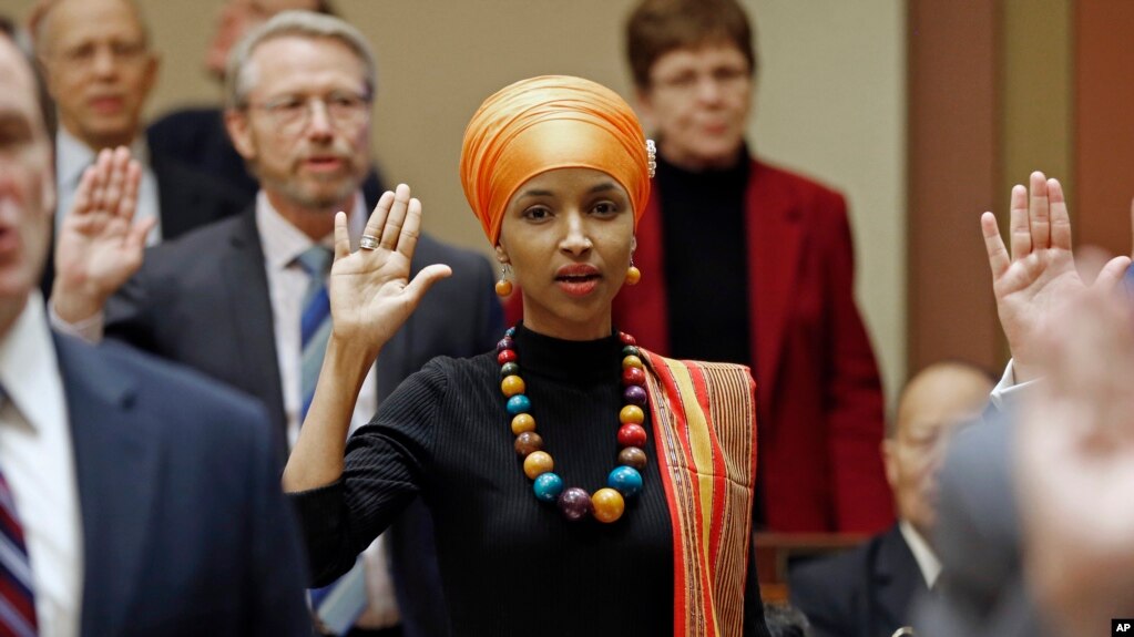 State Rep. Ilhan Omar takes the oath of office as the 2017 Legislature convened Tuesday, Jan. 3, 2017, in St. Paul, Minn.