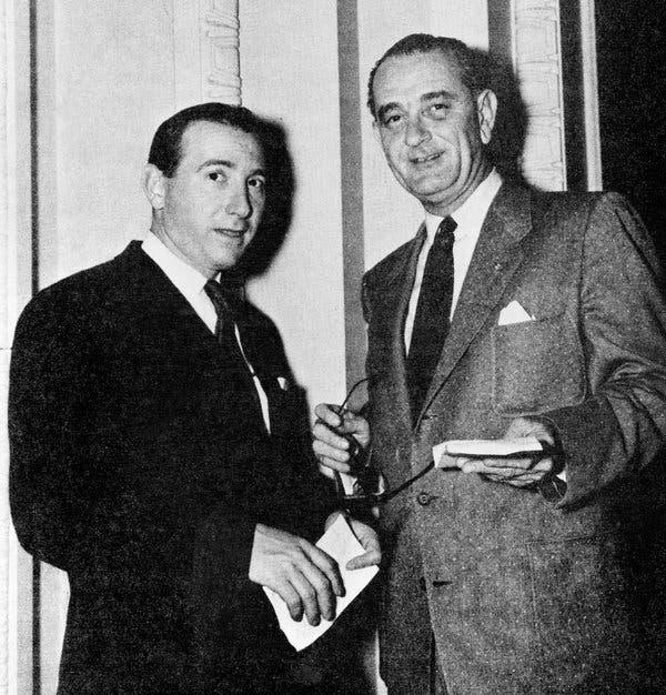 A couple of men in suits

AI-generated content may be incorrect.