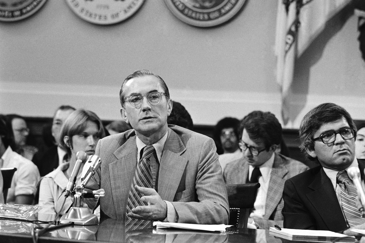 William Colby speaking during a hearing. 