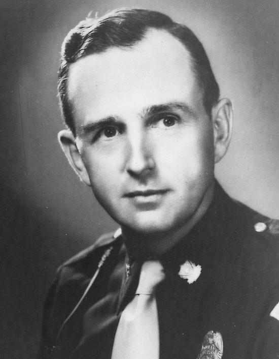 A close-up of a person in a uniform

Description automatically generated