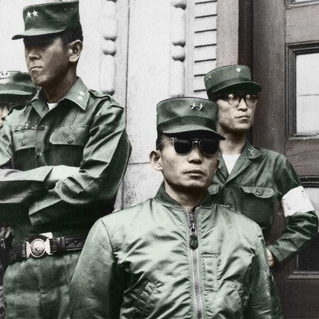 A group of men in military uniforms Description automatically generated with medium confidence