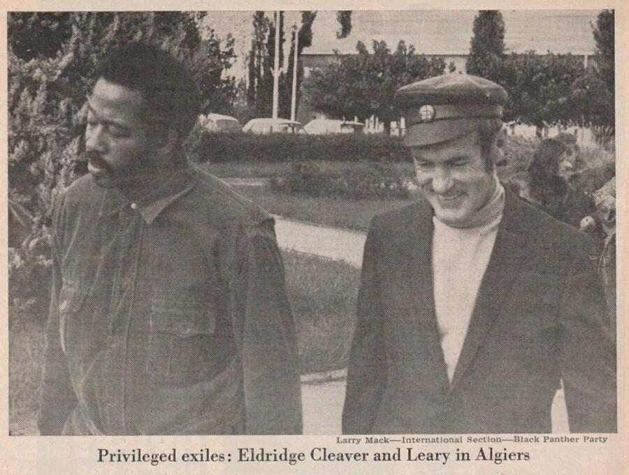 A person in a suit and hat walking next to another person

AI-generated content may be incorrect.