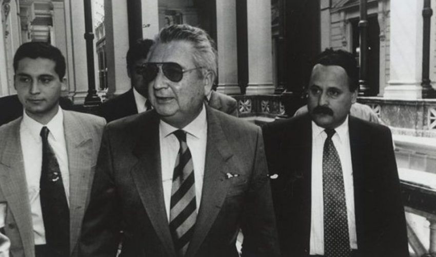 A person in a suit and tie

AI-generated content may be incorrect.