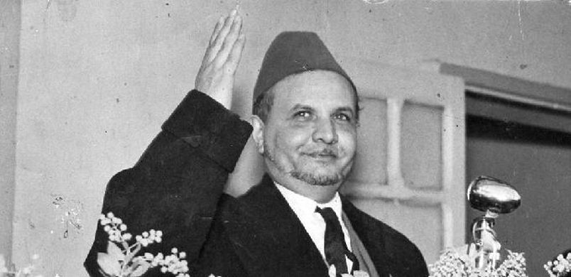 A person in a suit and tie saluting

AI-generated content may be incorrect.