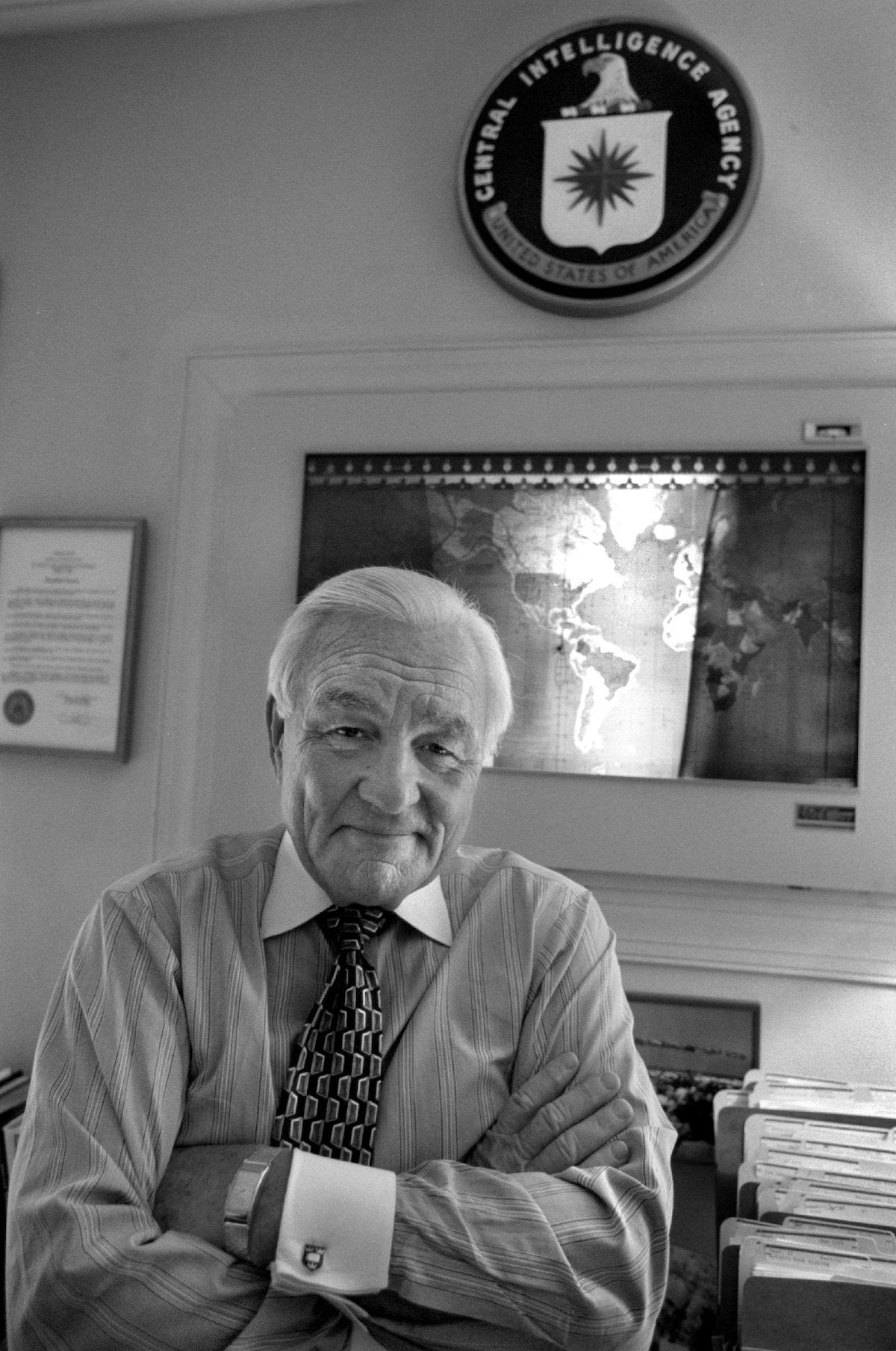 A person in a tie sitting in front of a map

AI-generated content may be incorrect.