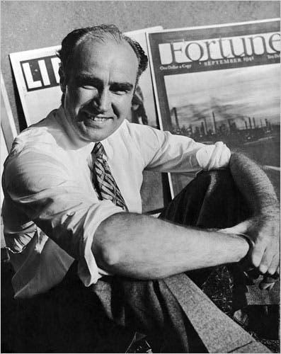 A person sitting with his arms crossed

Description automatically generated