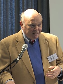 A person speaking into a microphone

AI-generated content may be incorrect.