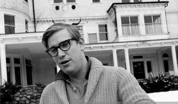 A person wearing glasses and a sweater

AI-generated content may be incorrect.