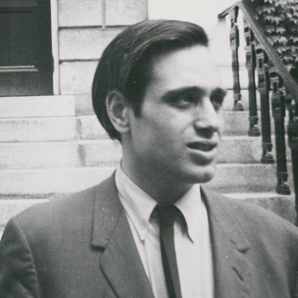 A black-and-white portrait of a young Edward Jay Epstein, wearing a jacket and narrow tie.