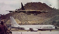 A large airplane flying over a large plane

AI-generated content may be incorrect.
