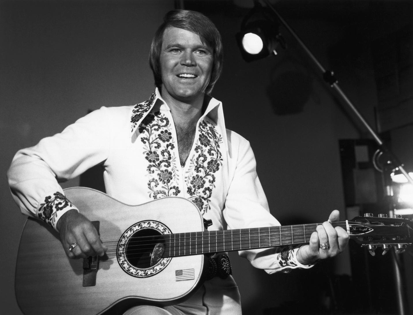 A person holding a guitar

AI-generated content may be incorrect.