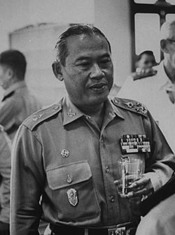 A person in military uniform holding a glass of water

AI-generated content may be incorrect.
