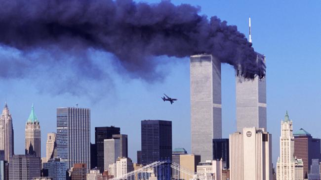 A plane flying over a tall building AI-generated content may be incorrect.