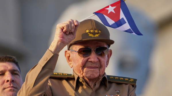Former Cuban President Raul Castro looks at the Cuban flag during his speech at the event celebrating the 65th anniversary of the triumph of the revolution in Santiago, Cuba, Jan. 1, 2024. (AP Photo/Ismael Francisco, File)
