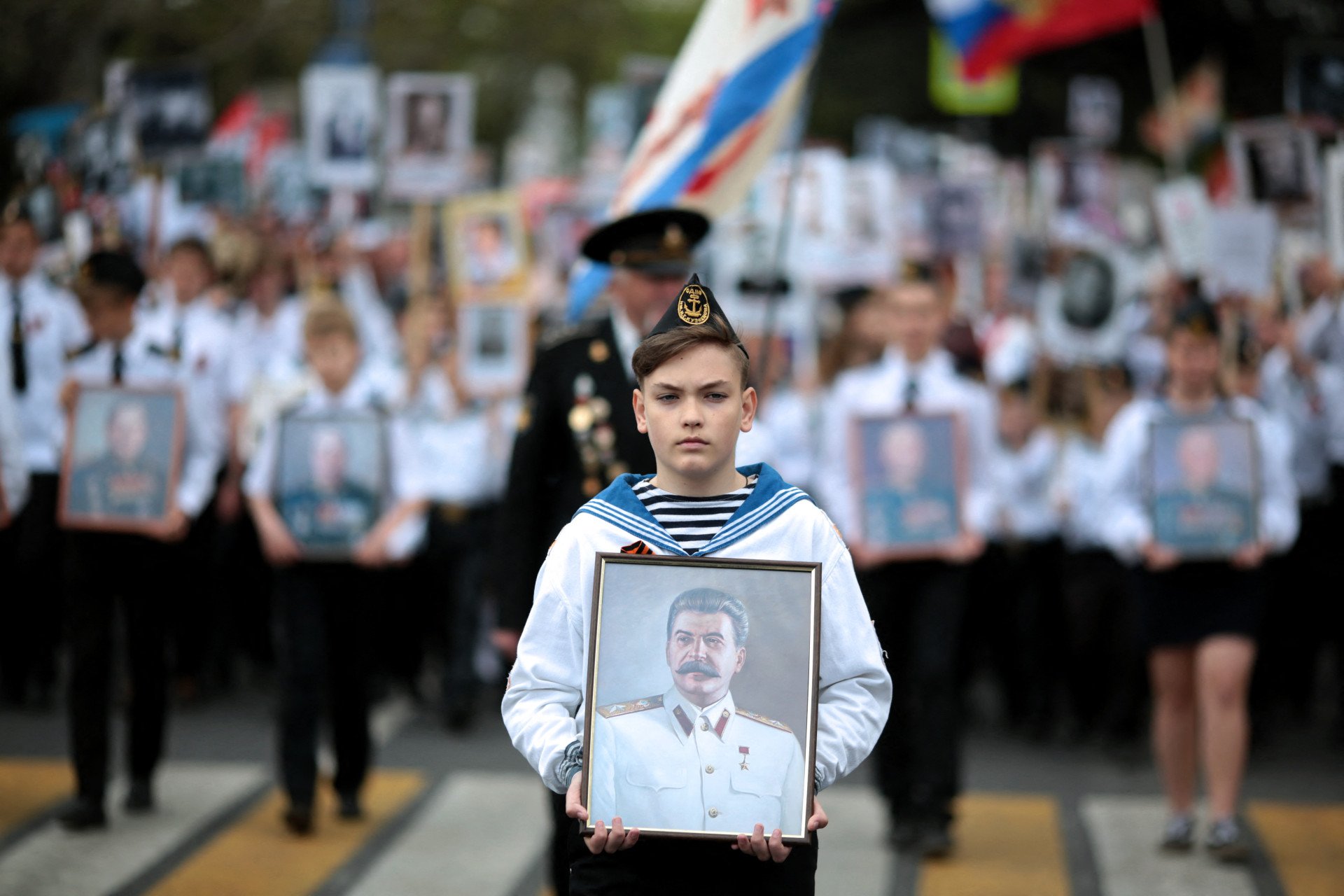 People carry portraits of the Soviet leader Joseph Stalin during the Immortal Regiment march in Russian-occupied Sevastopol, Crimea, on May 9, 2017. (Source: Getty Images)