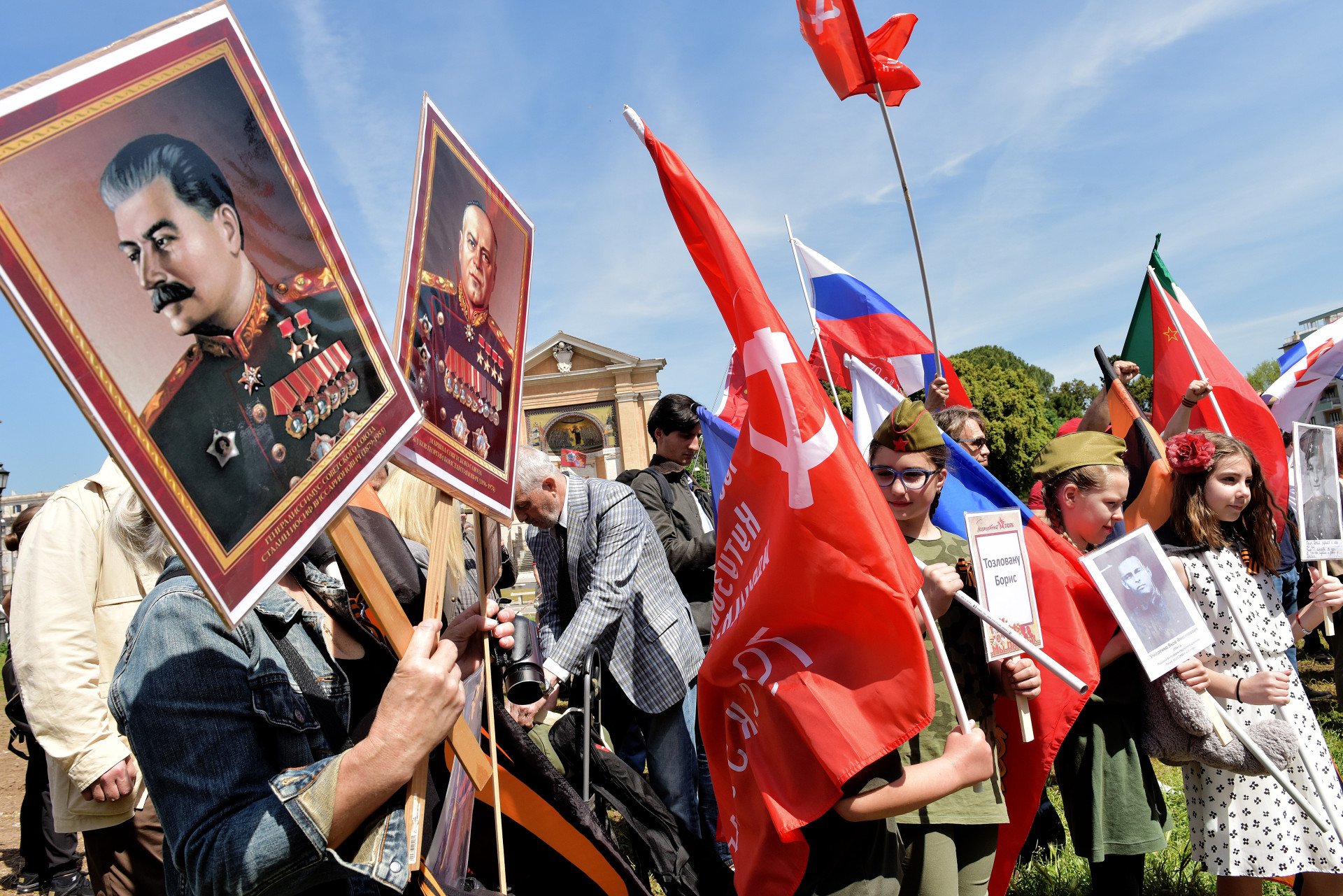 Russian women gather in Piazza San Giovanni to celebrate the Immortal Regiment, depicting Joseph Stalin, photos of the fighters, Soviet banners and St George’s ribbon on May 7, 2023 in Rome, Italy. (Source: Getty)