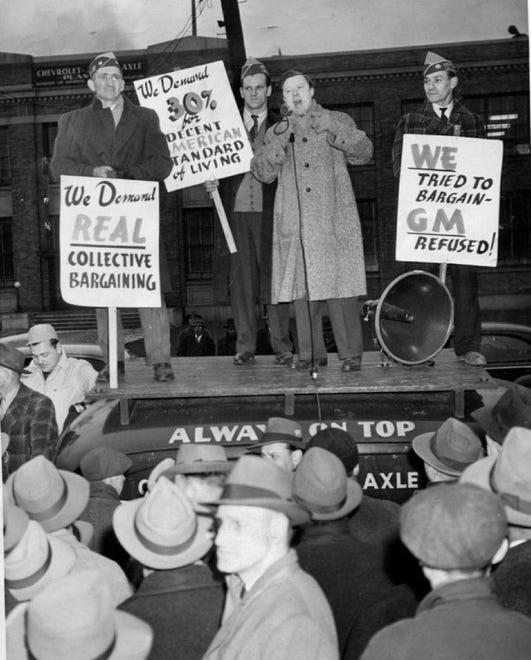 Walter Reuther, now vice president of the UAW-CIO, speaks to pickets grouped around a sound truck in front of the Chevrolet Gear and Axle Plant in Detroit on Nov. 23, 1945.
