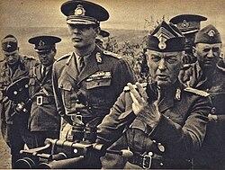 A group of men in military uniforms

AI-generated content may be incorrect.