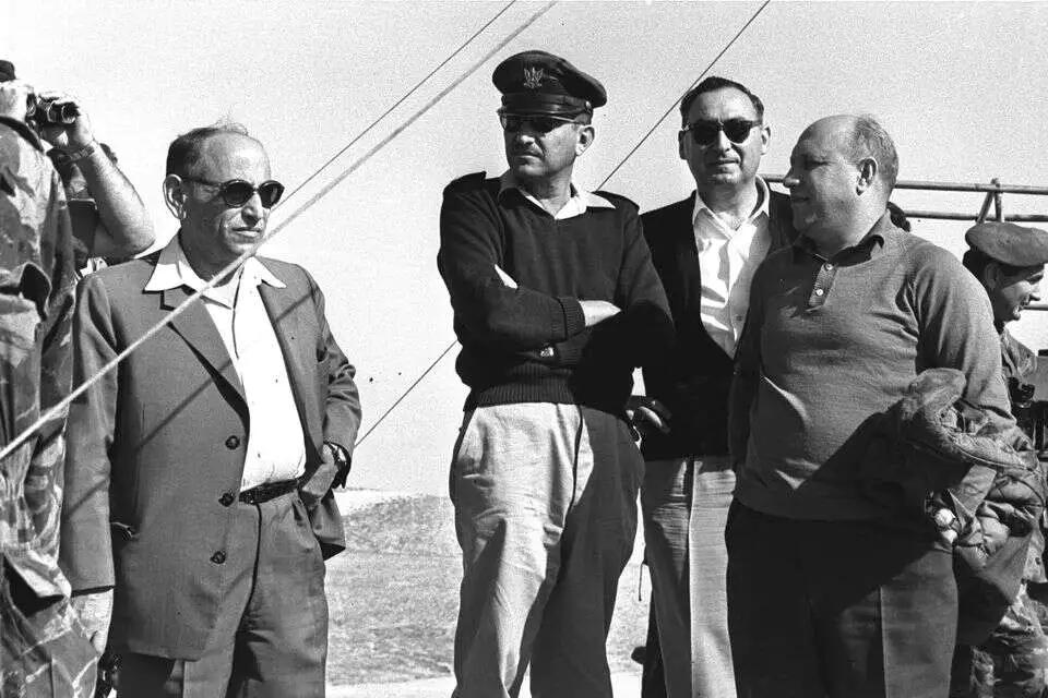 A group of men standing together
AI-generated content may be incorrect.