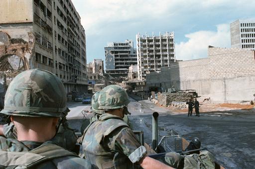 US Marines patrol a shell-damaged section of Beirut in a truck. The Marines  have been