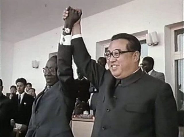 A group of men in suits holding hands
AI-generated content may be incorrect.