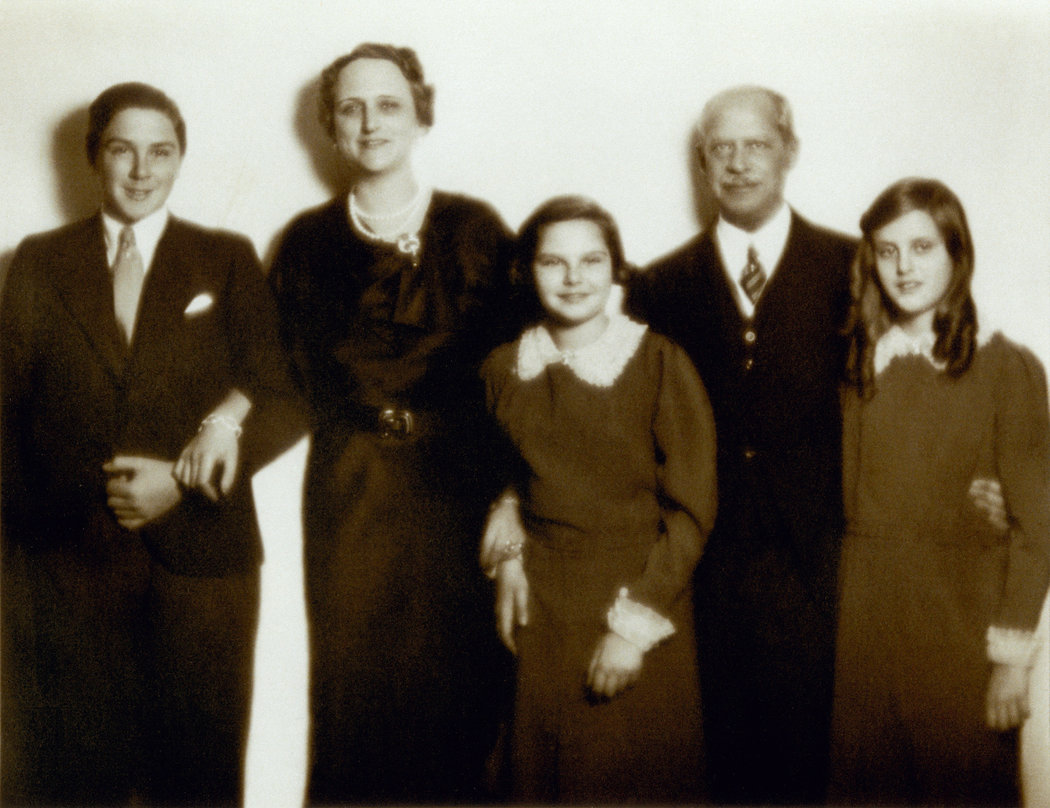 A group of people posing for a photo

Description automatically generated