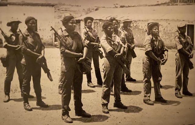 A group of women in military uniforms holding guns
AI-generated content may be incorrect.