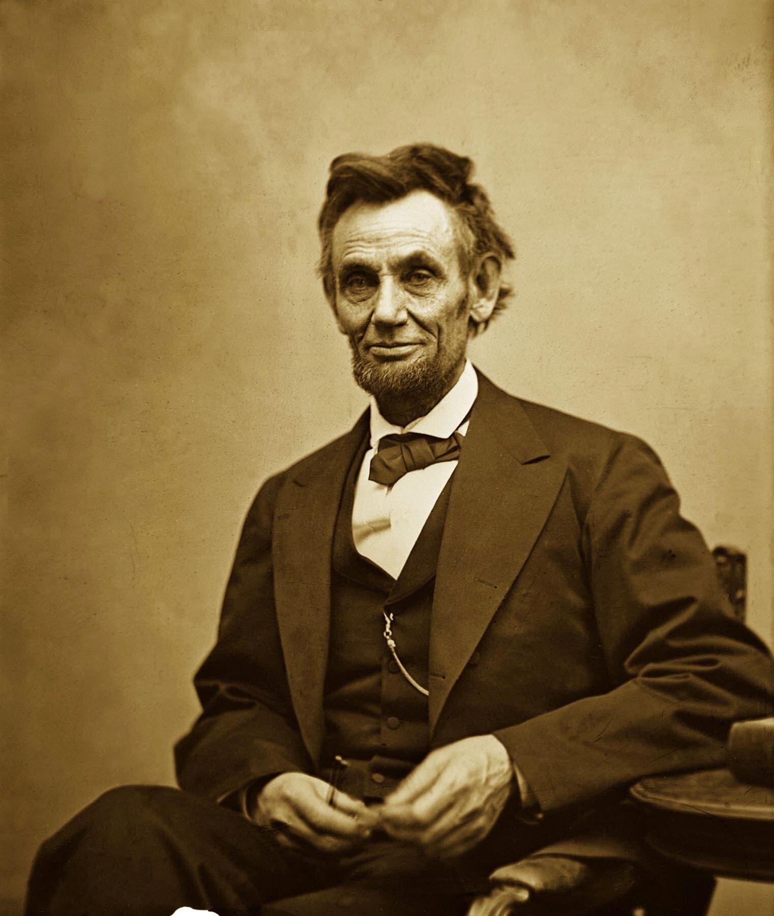 A person in a suit and bow tie with Seated Lincoln in the background

AI-generated content may be incorrect.